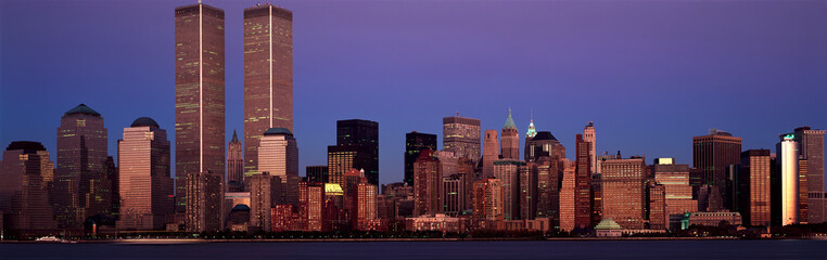 Panoramic view of lower Manhattan and New York City skyline, NY with World Trade Towers at sunset