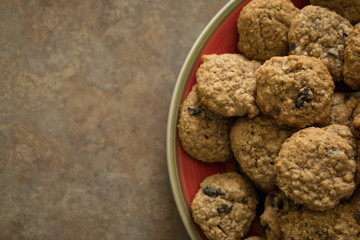 Off-centered plate of oatmeal cookies on a counter
