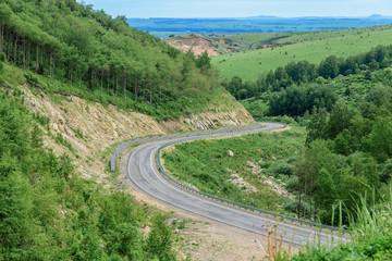 Serpentine road for cars in the rocky mountains.