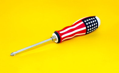 Screwdriver. Screwdriver close -up. Screw driver for screwing bolts and screws . Concept of repair and construction . Template.
