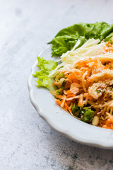 Detox salad. Raw fresh vegetables. Carrot, cabbage, salad leaves. Vegan, vegetarian diet