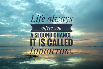 Inspirational quote - Life always offers you a second chance. It is called tomorrow. On blurry background of colorful sunrise light over horizon. Motivational words with beach nature landscape.