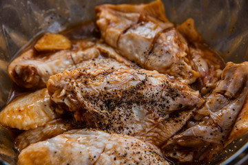  A bunch of pickled chicken wings in a bowl