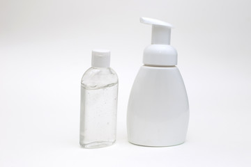white background with a white bottle of antibacterial soap and bottle antibacterial gel for hands