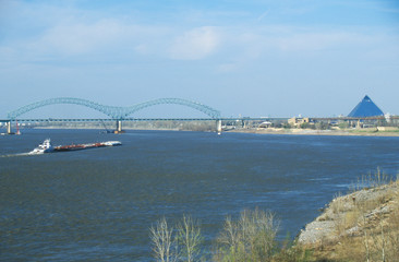 Barge on Mississippi River with Bridge and Memphis, TN in background