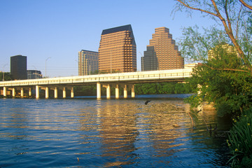 Skyline of Austin, TX, state capitol with Colorado River in foreground