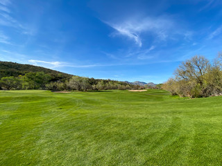 mountain country club green and blue sky