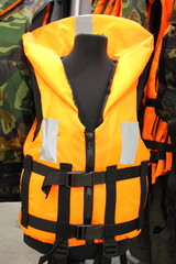 Bright yellow marine life vest close up, safety on water tourism activity and watersports