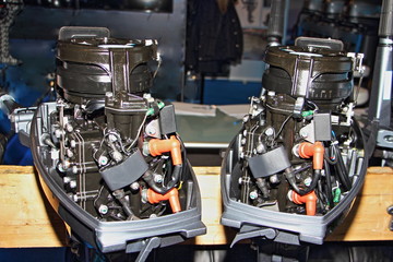 Two stroke outboard boat motors without covers close up