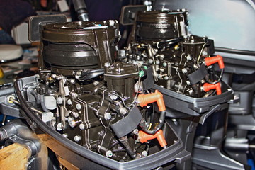 Two stroke outboard boat engines without bonnets close up