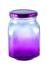 purple colored empty glass jar with screw cap close-up isolated on white