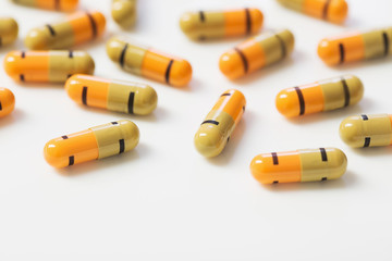 multicolored pills on  white   background