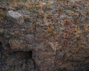 The stripes of large stones are brown.