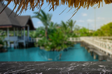 display products on the table, background, beside the pool and water pavilion