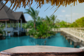 display products on the table, background, beside the pool and water pavilion