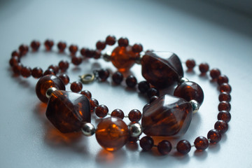 amber necklace on white background