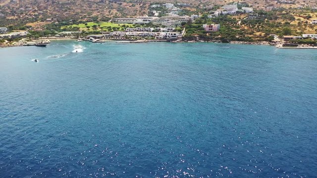 Aerial view of a person flyboarding in the sea. Elounda, Crete, Greece