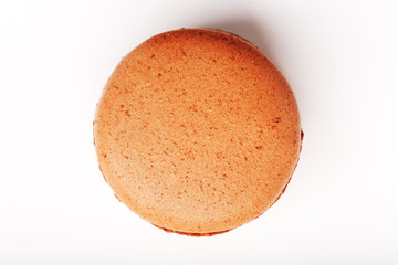 Chocolate macaroni cookies on a white background with brown filling, isolated.