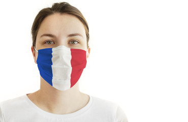 Coronavirus COVID-19. Young Woman With Face Mask and France Flag.