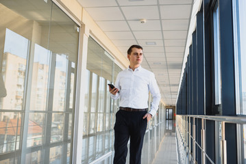 Fototapeta premium Businessman walking in the hall entrance