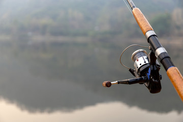 fishing rod with soft-focus and over light in the background