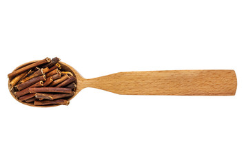 Dried Comarum palustre in a wooden spoon on a white background. Phytotherapy and disease prevention. Herbal collection for medicinal tinctures. Herbal tea in folk medicine. The view from the top