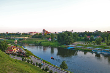 View of the Neman river and the city during sunset on a summer day.