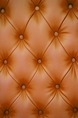 Vertical background of brown leather furniture upholstery