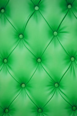 Vertical background of green leather furniture upholstery