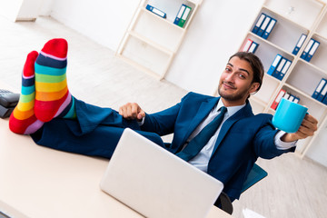 Young male businessman working in the office
