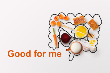 Healthy food. Creative collage with drawn intestine and wholesome products for wellbeing on white...