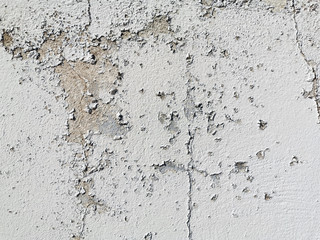 Peeling paint on a concrete wall. Selective focus.