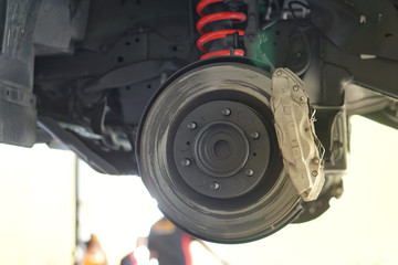  car brake part at garage,car brake disc without wheels.Disk brake and car disk brake system...