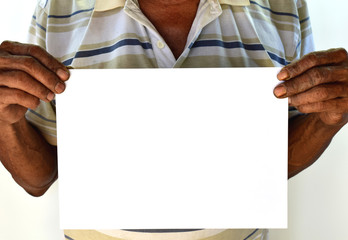 An old man with a white paper