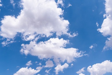 The blue sky with moving white clouds. The most of clouds are beautiful color and shade, suitable for use as background image.