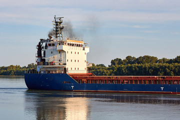 Blue cargo ship in the river