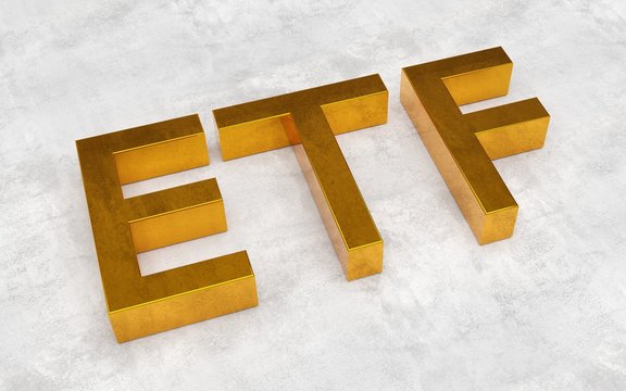 ETF - exchange traded funds - acronym in golden letters on concrete background