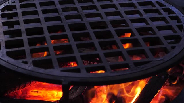 slow motion. fire is burning on the charcoal grill.Ofyr charcoal grill. close-up