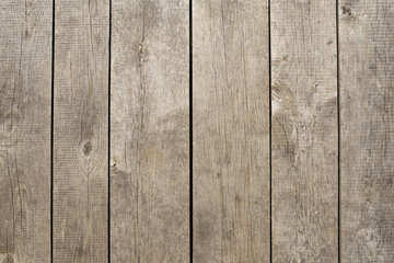 background with wooden boards, background with gray wood planks, background with vertical trees gray boards, photo of a table made of vertical trees with unpolished boards