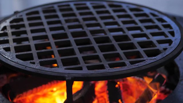 slow motion. fire is burning on the charcoal grill.Ofyr charcoal grill. close-up
