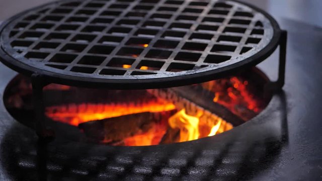 slow motion. fire is burning on the charcoal grill.Ofyr charcoal grill. close-up