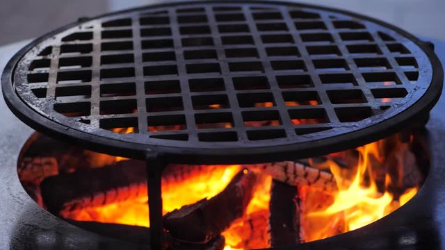 slow motion. fire is burning on the charcoal grill.Ofyr charcoal grill. close-up
