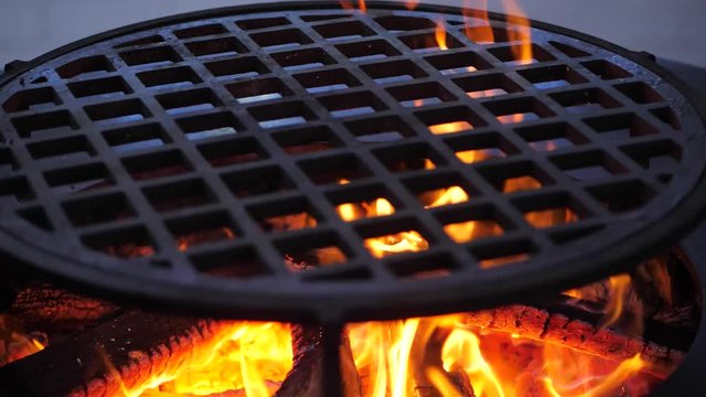 slow motion. fire is burning on the charcoal grill.Ofyr charcoal grill. close-up