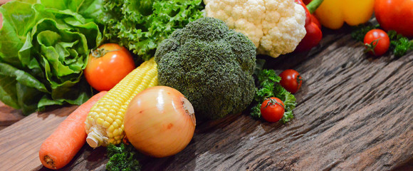 Mixed Vegetables and Salads on wooden Background.Select focus on Broccoli.
