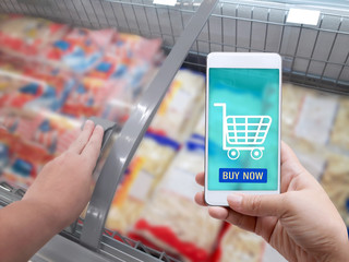 Online order grocery shopping on touch screen concept. Woman hand holding smart phone for delivery...