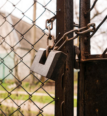 on an iron gate the castle weighs on a chain