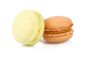 vanilla and caramel macaroons isolated on white
