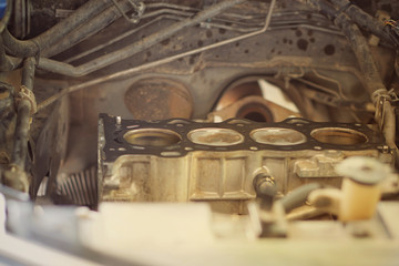 Car engine machine repairing by technician to change some part and modify something for return to using in car drive.Engine can't start need to repair.The mechanic is checking the engine.Close up. 