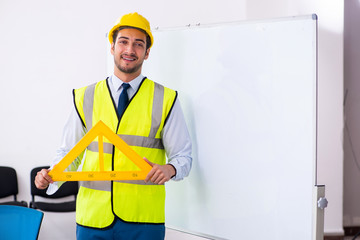 Young male architect in presentation concept