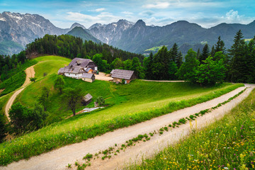 Rural farm in the forest glade with mountains, Slovenia © janoka82